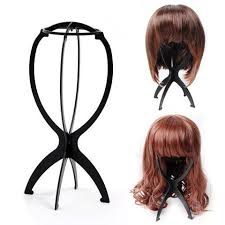 wig stand with hair.jpg